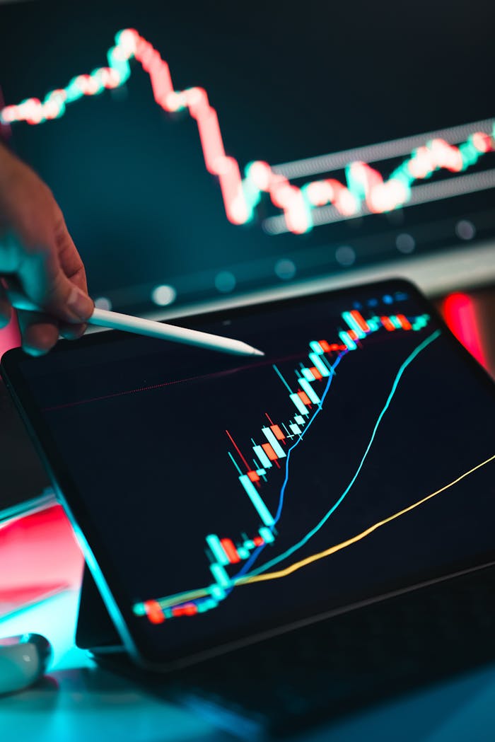 about-us Close-up of cryptocurrency trading analysis on a digital tablet, highlighting market trends.